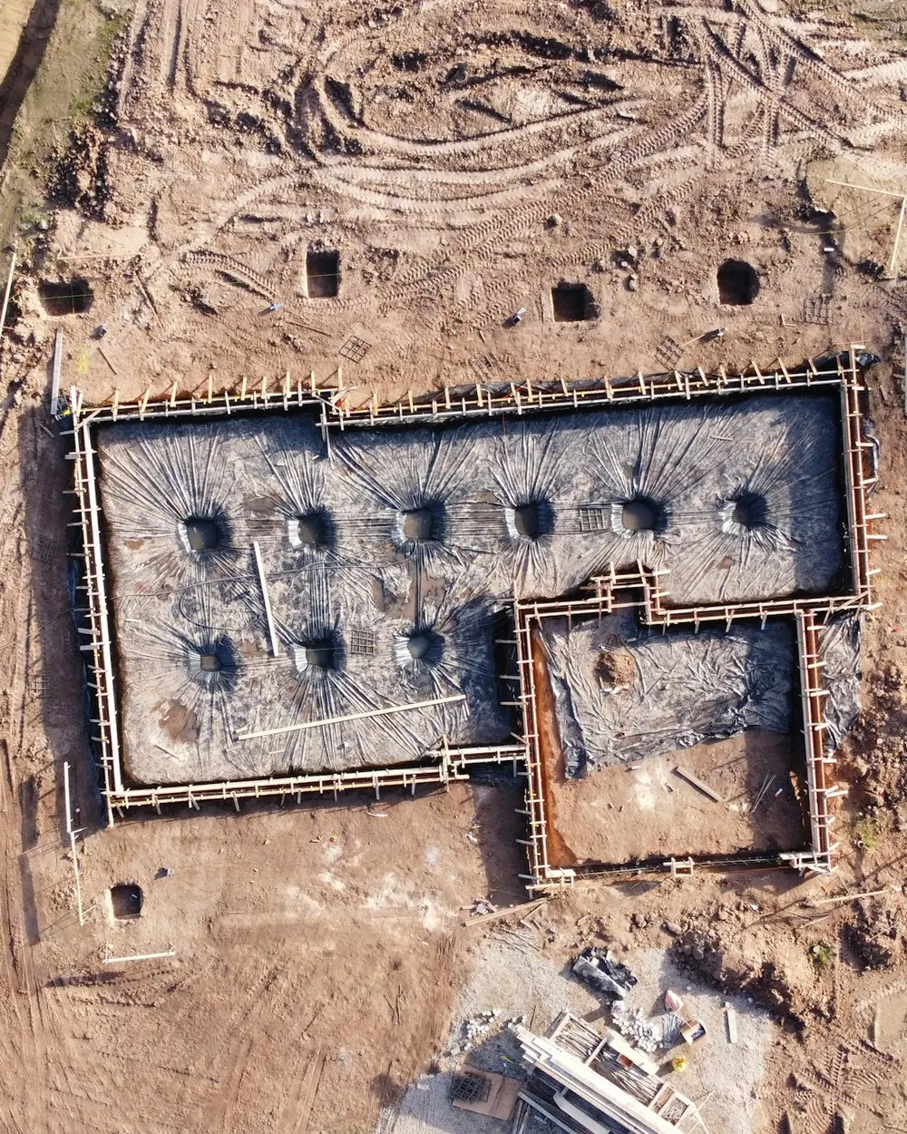 A new home's basement foundation walls from above, ready for framing