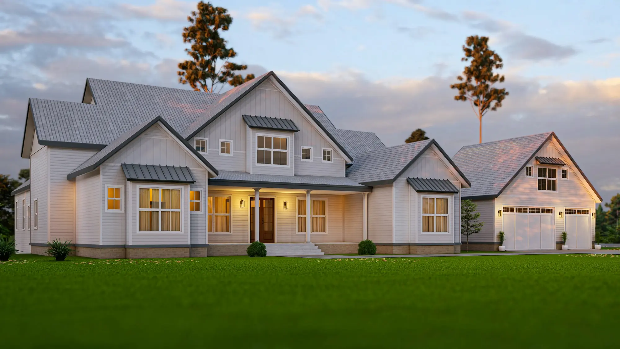 Large white farmhouse with lit windows at dusk