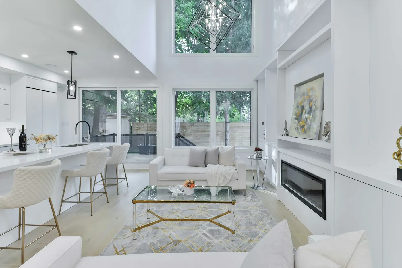 Two-story great room open to the kitchen, with a fireplace